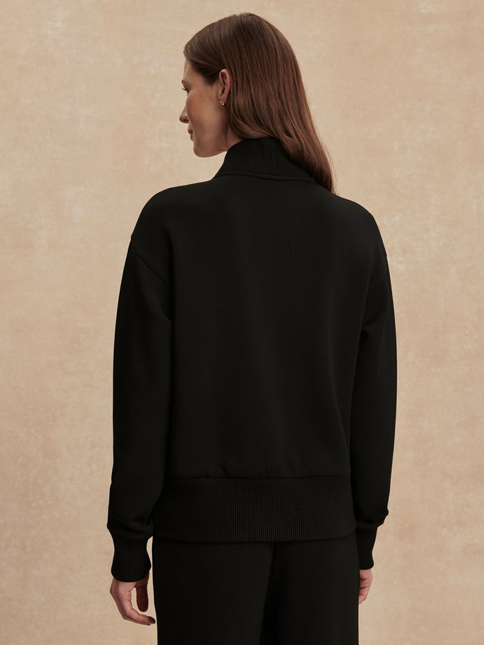 Black|Front view of the Sally Half Zip Sweat in Black, featuring a half-zip neckline and long sleeves.