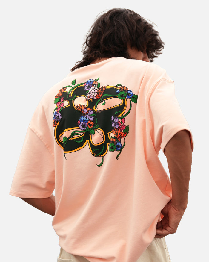 Seashell pink oversized t-shirt with garland print