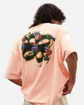 Seashell pink oversized t-shirt with garland print