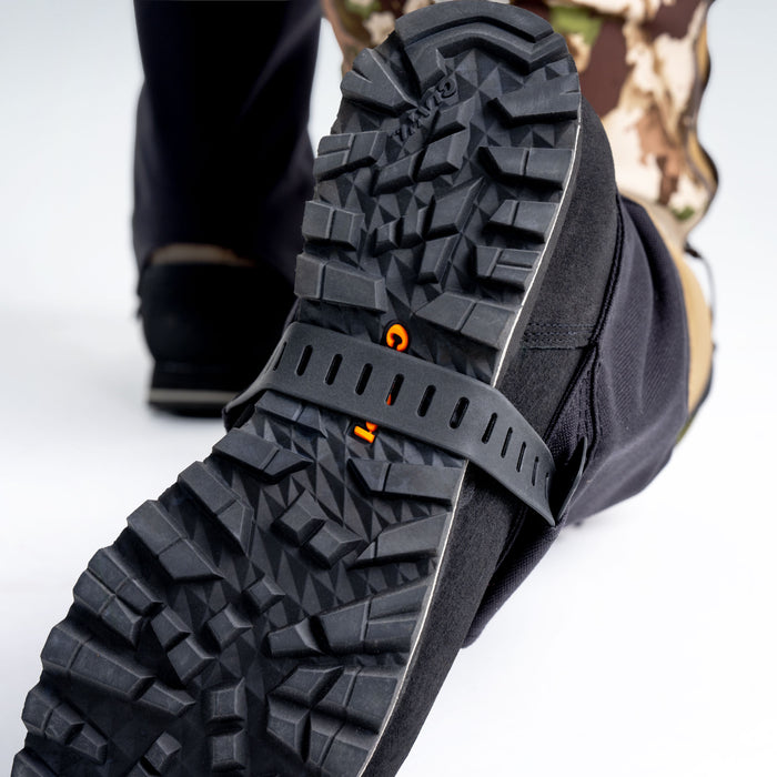 Close up of hunting boot bottom with boot gaiter strap