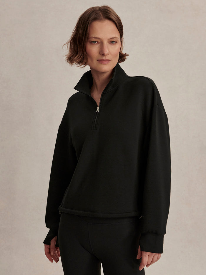 Black|Varley Sian Cropped Half Zip Midlayer in Black, a cropped midlayer with a stand-up collar and front half-zip.