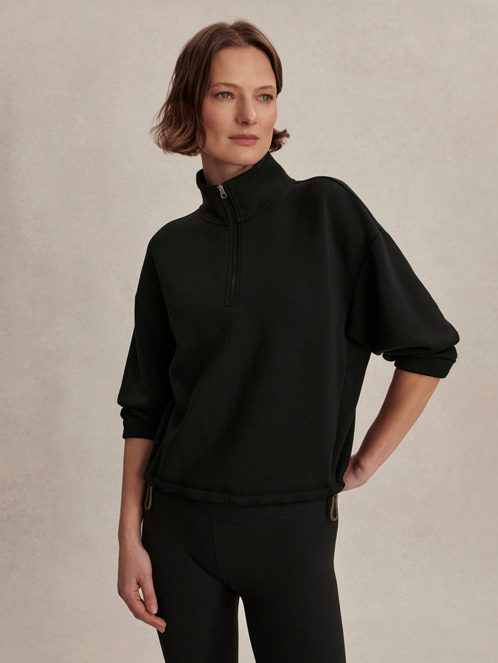 Black|Sian cropped half-zip midlayer in Black, front view showing a cropped silhouette, high neck and half-zip detail.