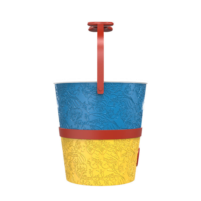 Angle view of the glossy red plastic apple popcorn bucket showing its iconic shape and generous size