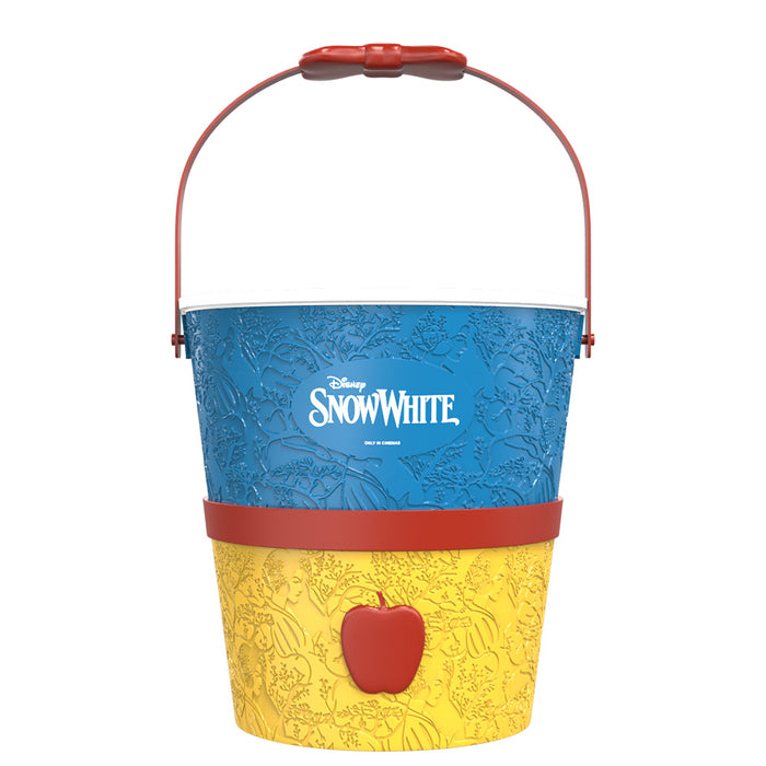 Close-up of the textured apple surface and sculpted stem detail on the top of the bucket
