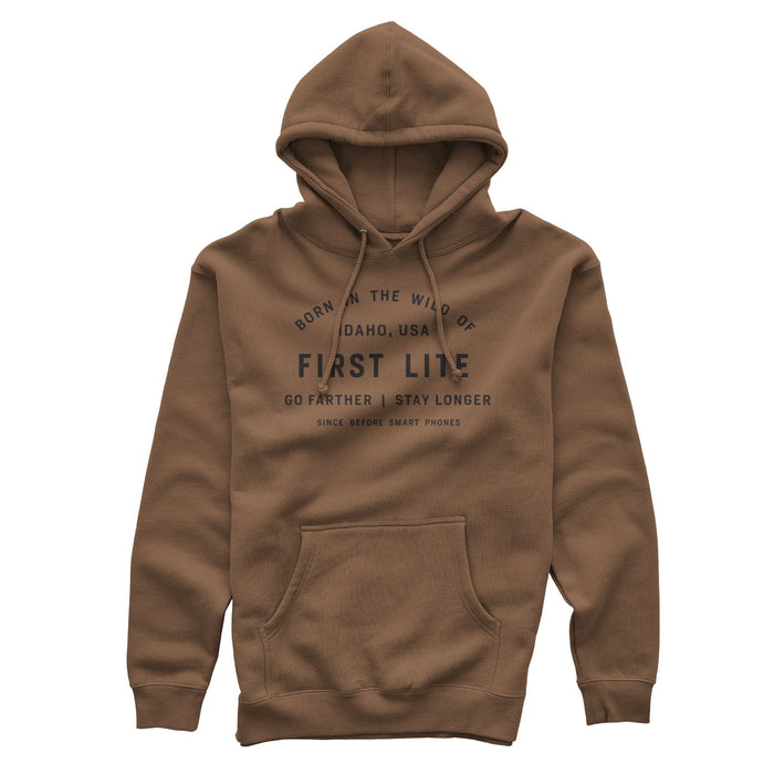 Saddle hoodie with black text on the front saying 'Born in the wild of Idaho, USA, First Lite, Go farther | Stay longer, Since before smart phones', a drawstring hood, and a kangaroo pocket.