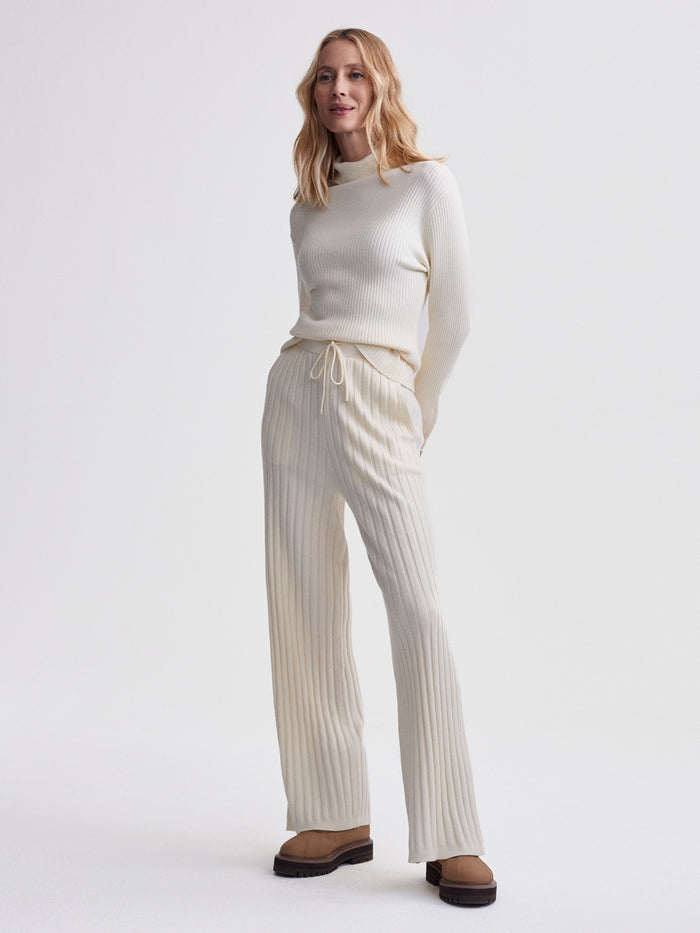 Egret|Front view of Simeon Wide Rib Knit Trouser in Egret, a relaxed-fit knit trouser with pronounced wide rib texture.