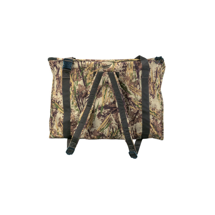 Camouflage duffel bag in greens, browns, and tans, featuring backpack straps, top carry handles, and a side buckle.