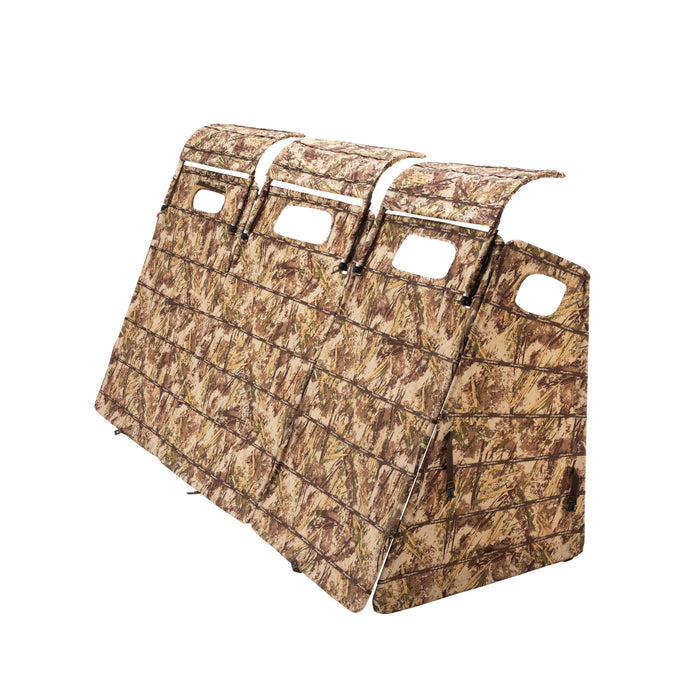 A multi-panel hunting blind with a brown and green grass camouflage pattern, featuring four rectangular openings.