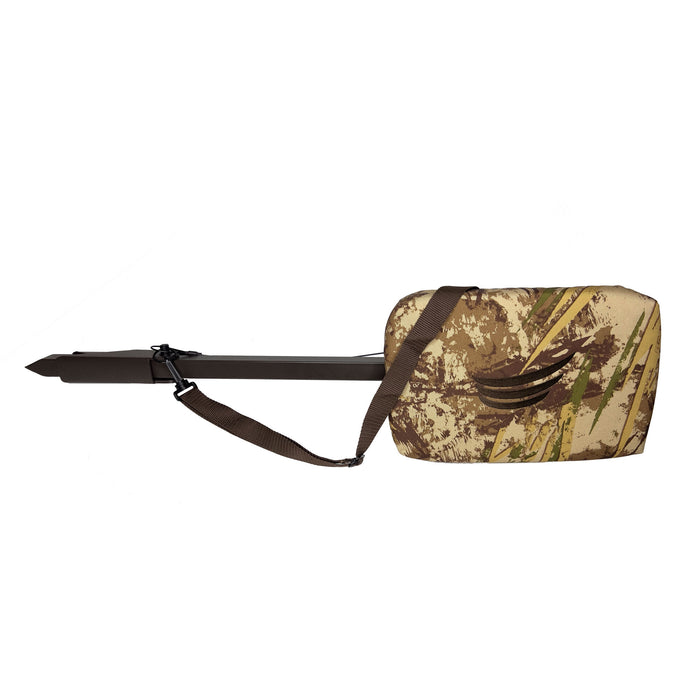 Brown hunting seat with a pointed stake and a camouflage padded cushion, featuring a brown shoulder strap and side handle.