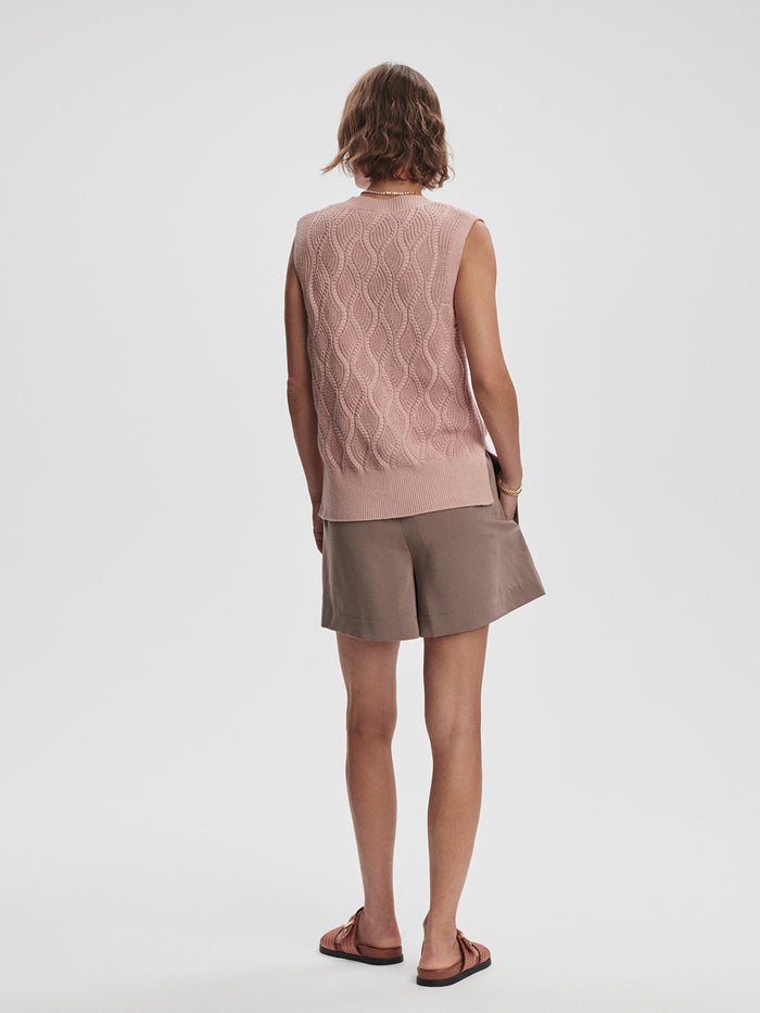 Misty Rose|Front view of the Varley Teller Longline Knit Tank in Misty Rose, a soft pink sleeveless knit with extended hem and relaxed silhouette.
