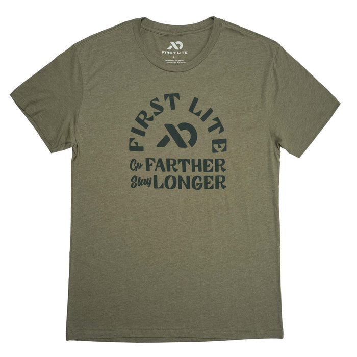 Heather olive green t-shirt with an arched "FIRST LITE" logo and "Go FARTHER Stay LONGER" text printed on the front.