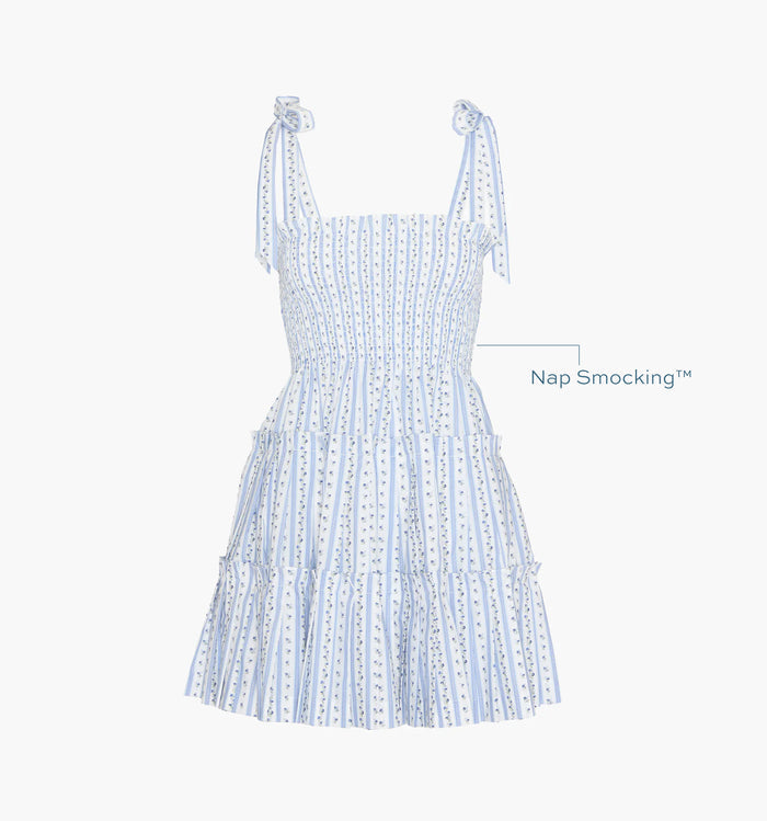 Image of a Nap Dress with text highlighting it's Nap Smocking™ color: Blue Petal Stripe