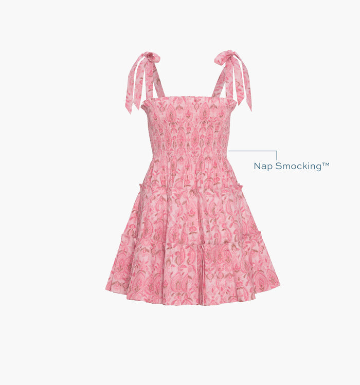 Image of a Nap Dress with text highlighting it's Nap Smocking™ color: Pink Palm Ikat
