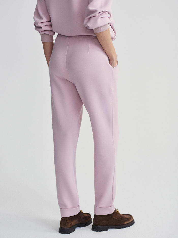 |The Rolled Cuff Pant 25 in Burnished Lilac, front view showing a relaxed tapered fit with rolled cuffs in a soft lilac shade.