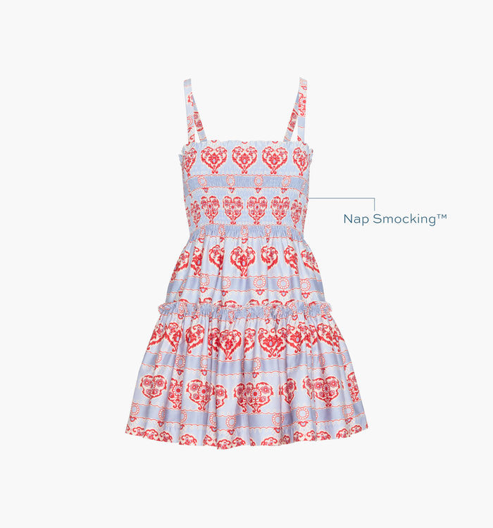 Image of a Nap Dress with text highlighting it's Nap Smocking™ color: Poppy Damask Stripe