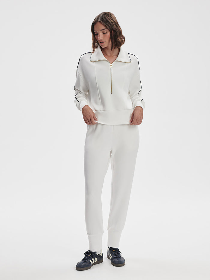 White|Front view of Varley Slim Cuff Pant in White, a slim-fit cuffed jogger with a clean flat-front design.