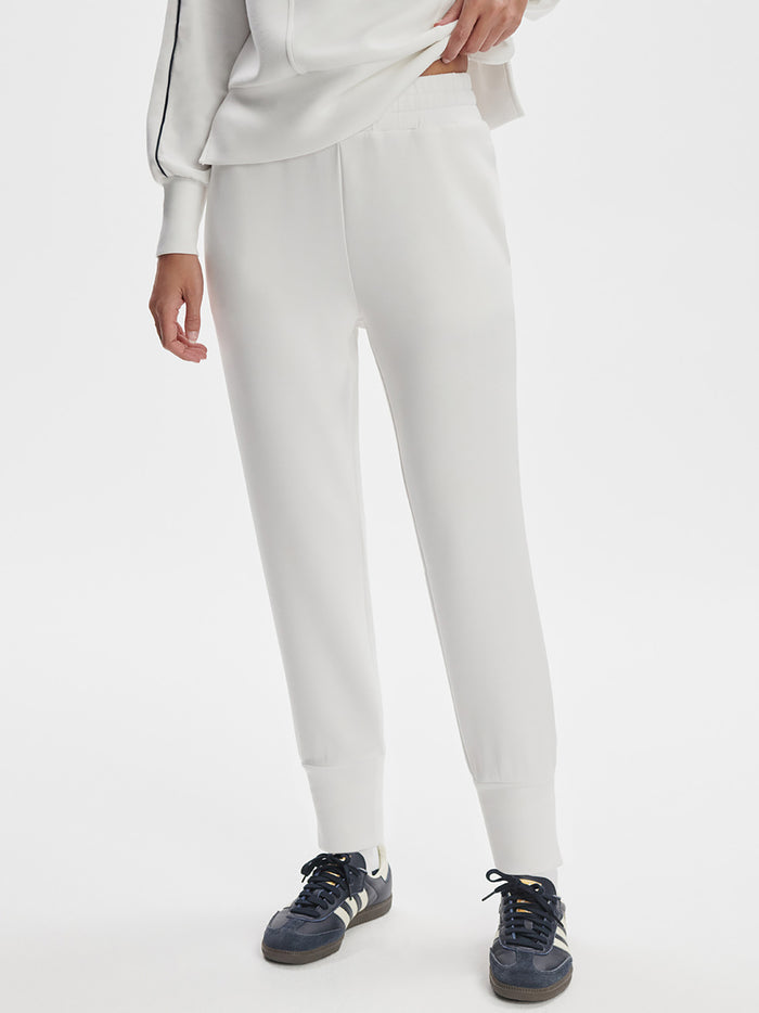 White|Varley Slim Cuff Pant in White, front-view product shot with a slim tapered leg and ankle cuff.