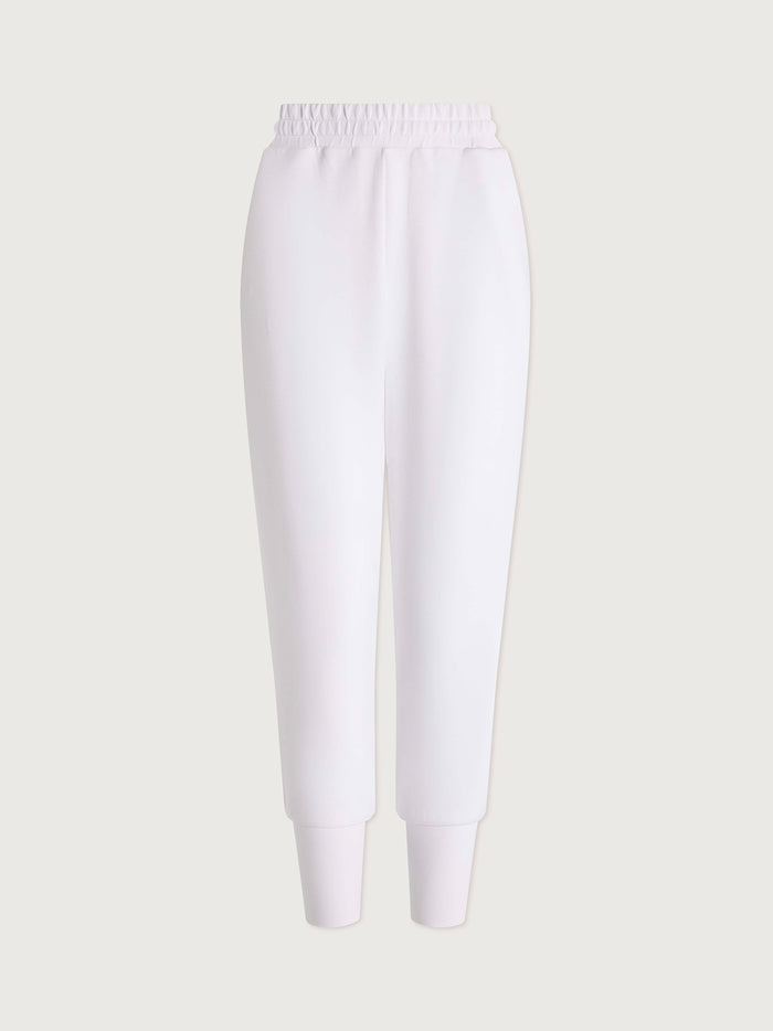 White|The Slim Cuff Pant in White - front view of a slim-fit, full-length pant with cuffed hem.