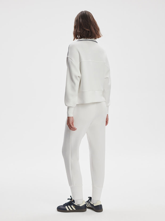 White|Varley Slim Cuff Pant in White, front view showing a slim tapered leg with a cuff.