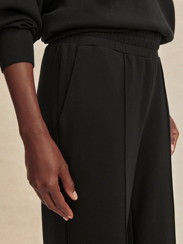Black|The Wide Leg Pant 32 Black by Varley, front view of black wide-leg pants with a relaxed fit.