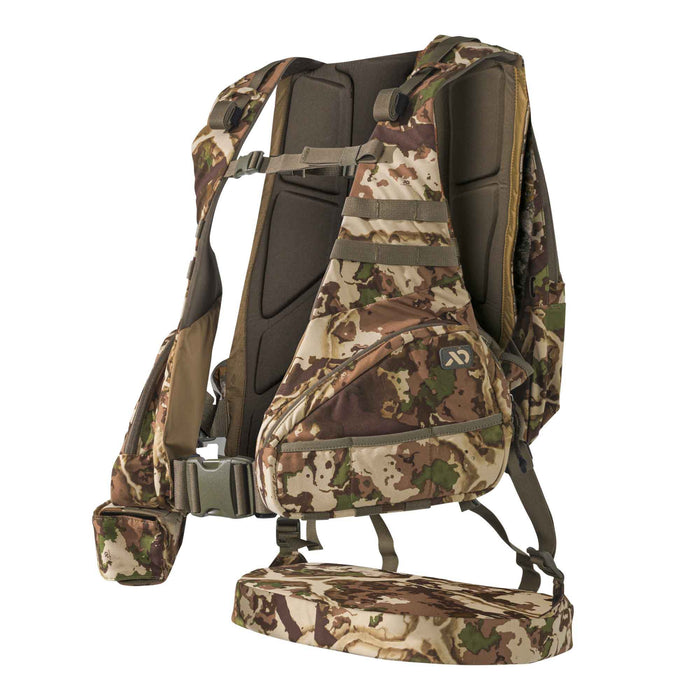 Camouflage hunting vest system with a large front pouch, padded back panel, and lower fold-down platform.