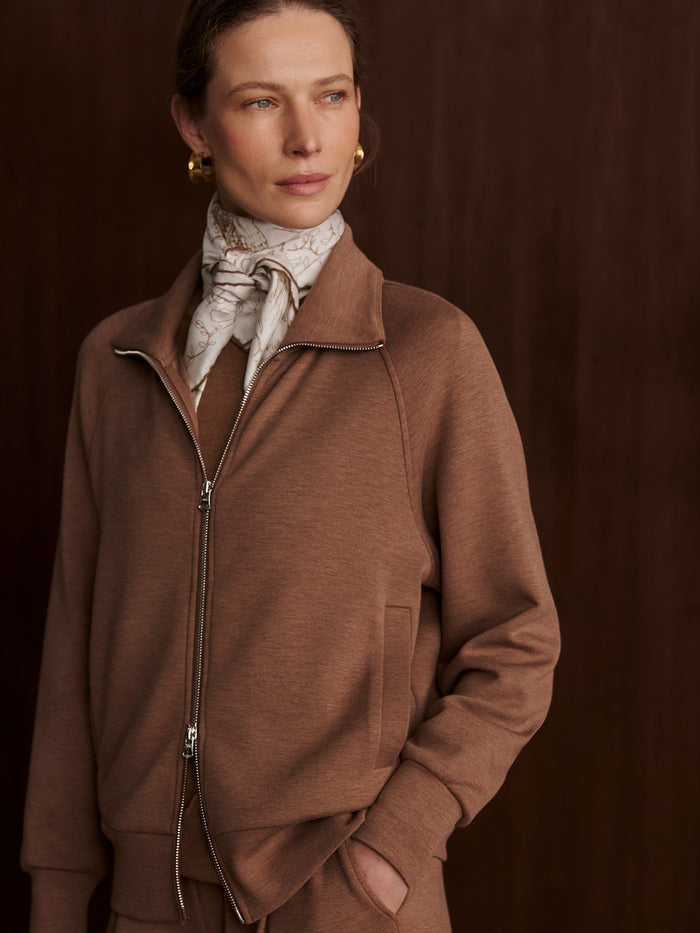 Golden Bronze Marl|Product image of the Varley Tyde Zip Through Sweat in Golden Bronze Marl DoubleSoft Fabric, a zip-through sweatshirt with high collar and long sleeves.