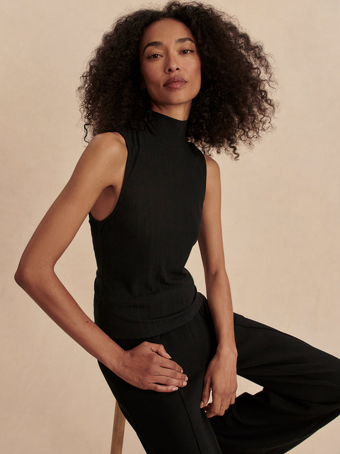 Black|Front view of the Varley Caley Fitted Rib Tank in Black, a sleek rib-knit tank top with a fitted silhouette.