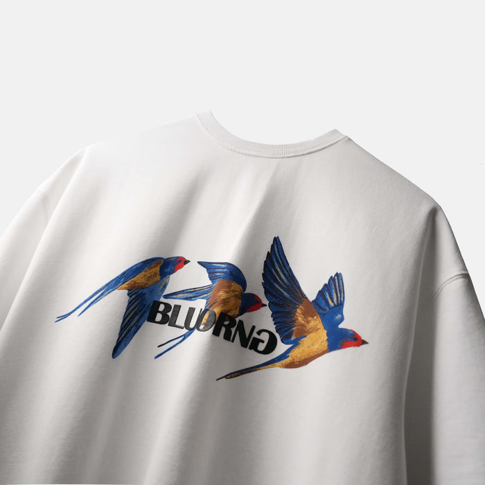 White oversized premium tee featuring bold bird motif