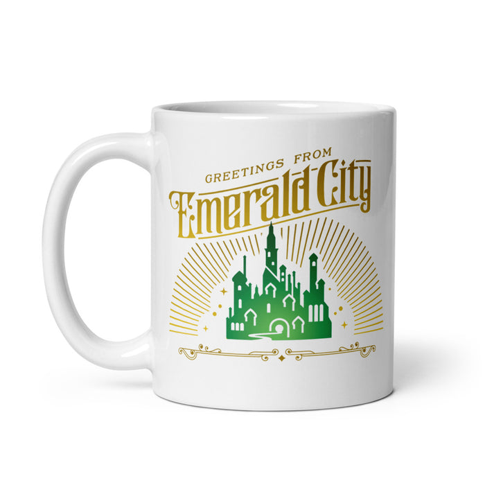 White ceramic coffee mug featuring a vibrant Emerald City graphic illustration from Wicked on the front