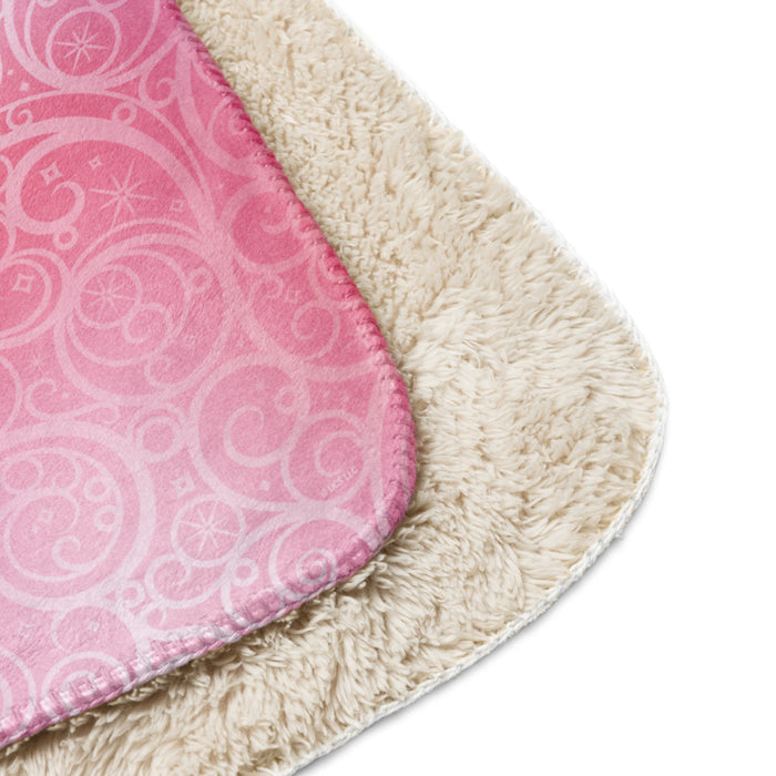 Wicked sherpa blanket rolled and tied with a decorative ribbon for gifting