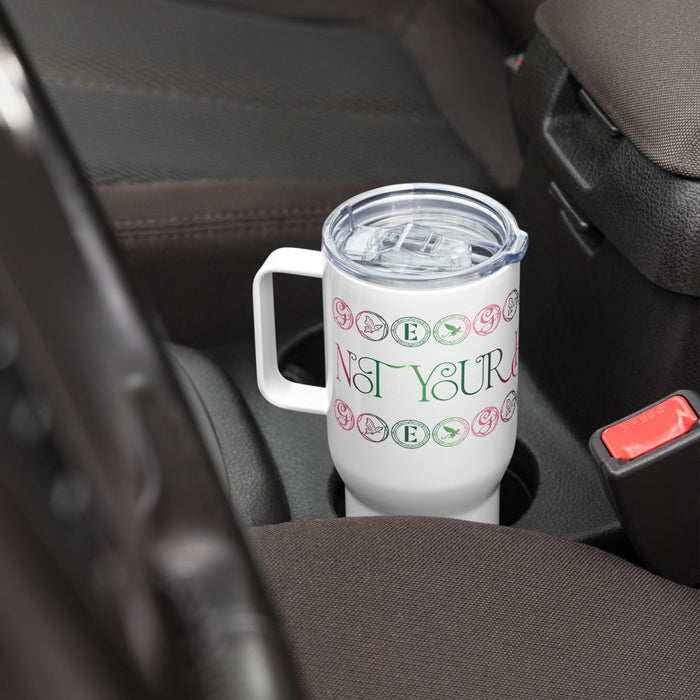 Lifestyle view of the Wicked travel mug resting on a clean surface