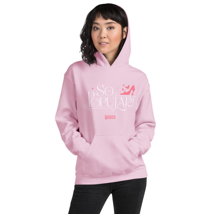 Close-up detail of the graphic print on the front chest of the light pink hoodie