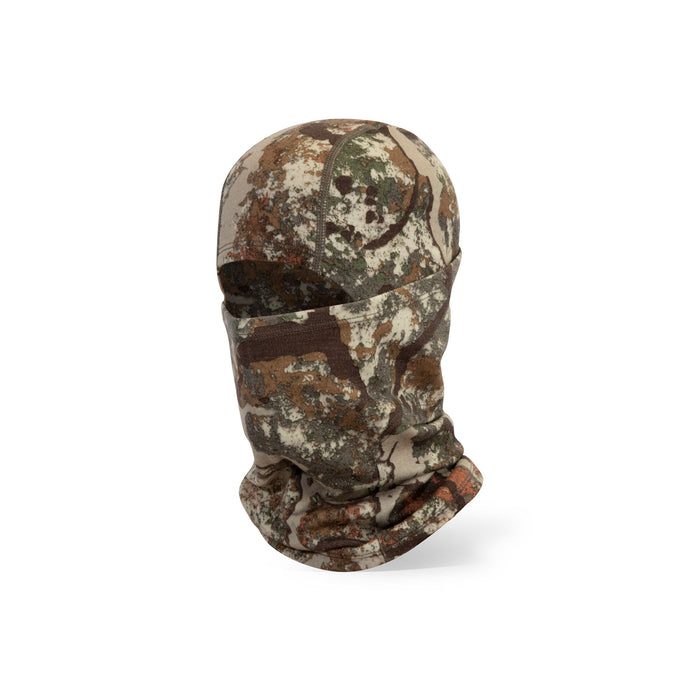 Camouflage balaclava in a mottled pattern of brown, green, and tan, with a single face opening.