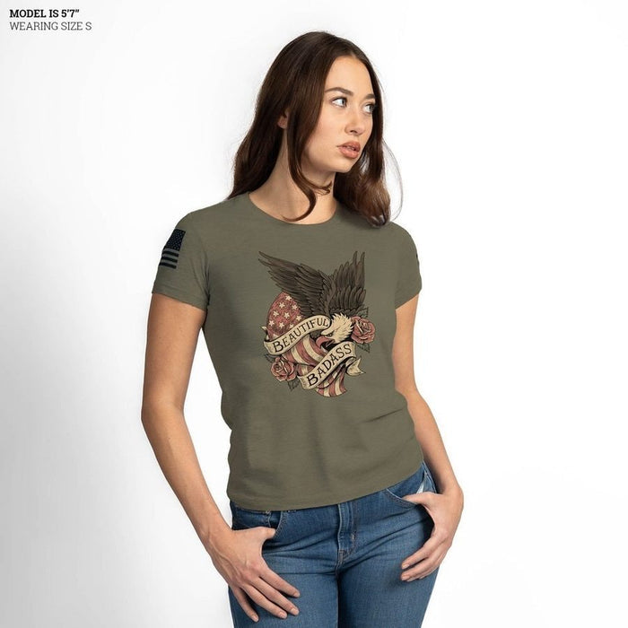 Woman wearing a green t-shirt with an eagle and American flag design on a white background